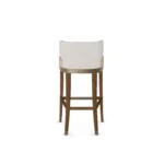 Méredith upholstered bar chair by Nolita Harbour, velvet seat with wood base and curved back, elegant modern design.