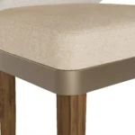 Méredith velvet bar chair detail by Nolita Harbour, luxury upholstered stool with tapered wood legs and supportive curved back.