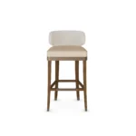 Méredith luxury bar stool by Nolita Harbour, velvet chair with tapered timber legs, metal footrest, and sculptural comfort.