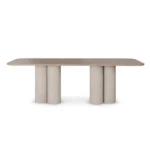 Petra Dining Table, a minimalist dining table by Nolita Harbour in Light Emperador marble, blending clean lines with a sculptural base