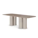 Petra Dining Table, an elegant dining table by Nolita Harbour in Light Emperador marble, featuring a sculptural top and cylindrical base