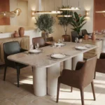 A dining room by Nolita Harbour, with the centerpiece being a light emperador marble Petra dining table.