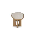 Modern dining table with a travertine top and varnished oak legs, featuring an organic-shaped tabletop and a sculptural base, by Nolita Harbour. side view