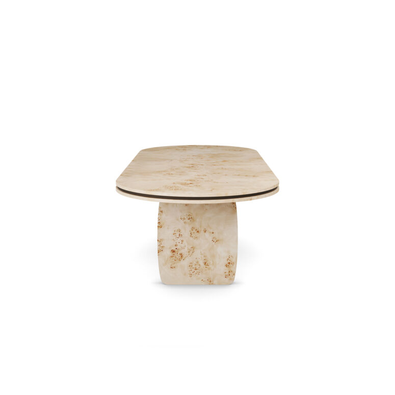 Assia dining table made of poplar root with sculptural legs and polished brass detailing. Side view