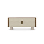 Perrine sideboard with ribbed travertine legs, walnut body, Alpinina marble top, synthetic wicker doors, and aged brass handles. Nolita Harbour front view