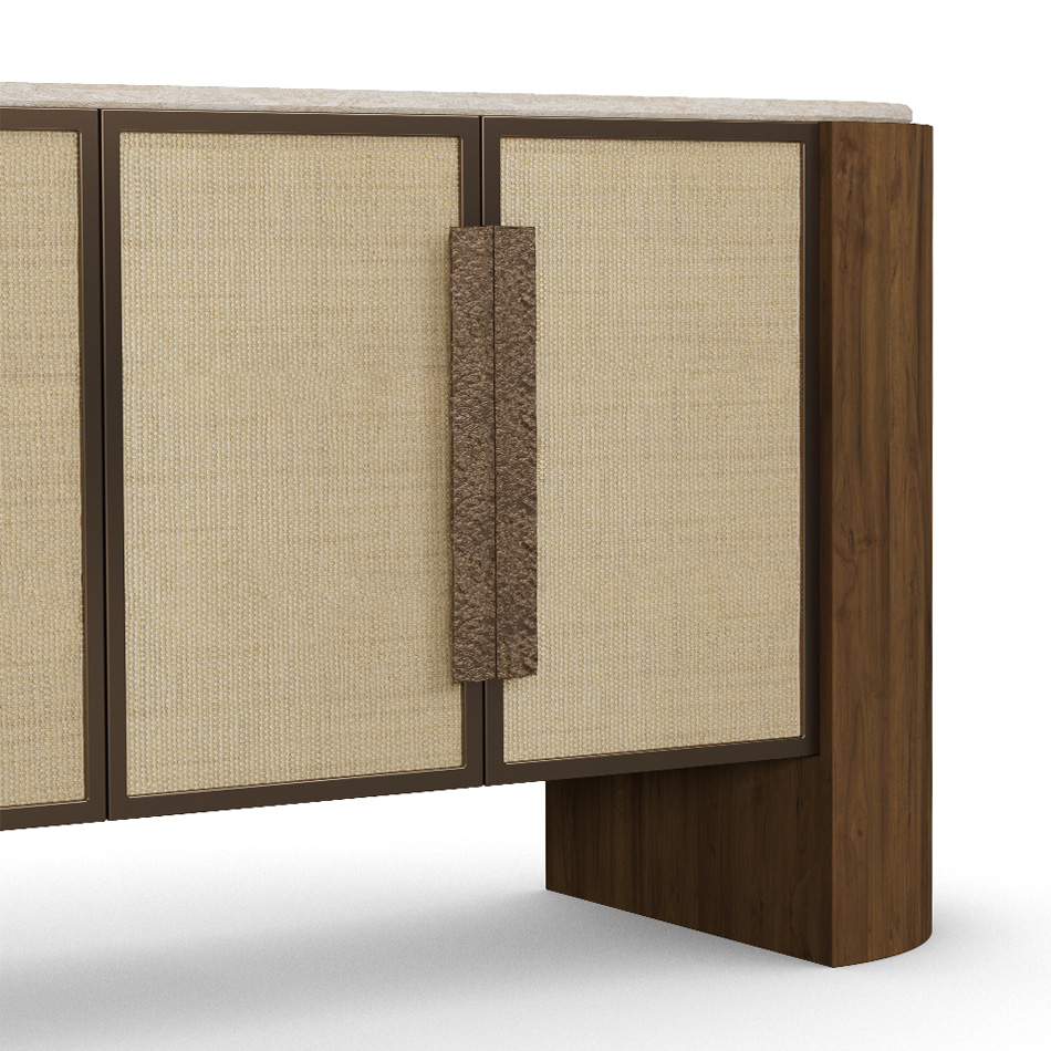 Capucine sideboard with a travertine top, walnut frame, synthetic wicker cabinet doors, and hammered aged brass handles. detail view