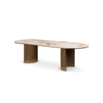 Coralie Dining Table, an elegant dining table by Nolita Harbour in Aegean Rose marble and walnut, with a refined oval form.
