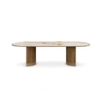 Coralie Dining Table, a sculptural dining table by Nolita Harbour in marble and walnut, offering a calm presence.