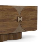 Ninon walnut sideboard with travertine top, ribbed base, and brass handles. Detail view