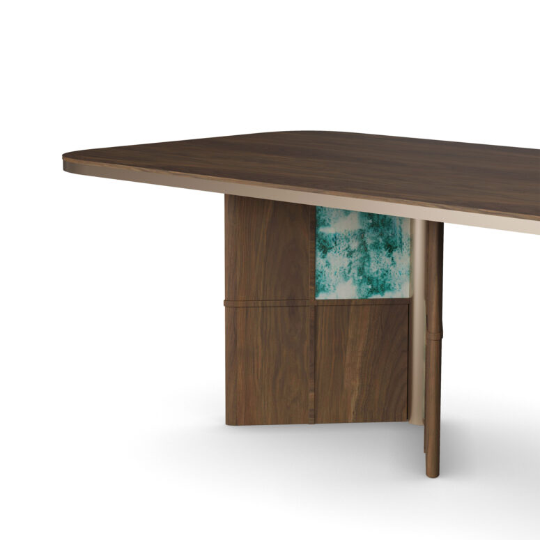 Contemporary dining table with a walnut tabletop, ceramic-accented legs in green, and brass tubing details, designed by Nolita Harbour. detail 2 view