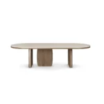 Assia II Dining Table, a refined dining table by Nolita Harbour that combines a travertine top and timber base for balance.