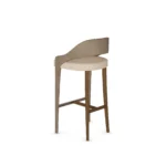 Dini wood bar chair by Nolita Harbour, luxury upholstered stool with curved back, timber frame, and refined metal detail.