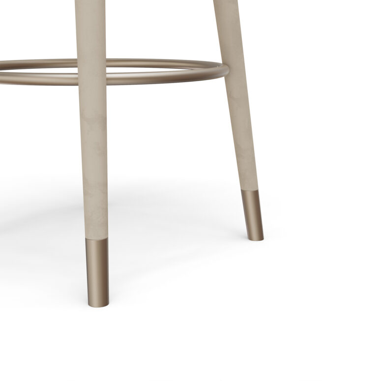 Minimalist backless bar stool with a curved seat, sleek frame, and a circular footrest, designed by Nolita Harbour.