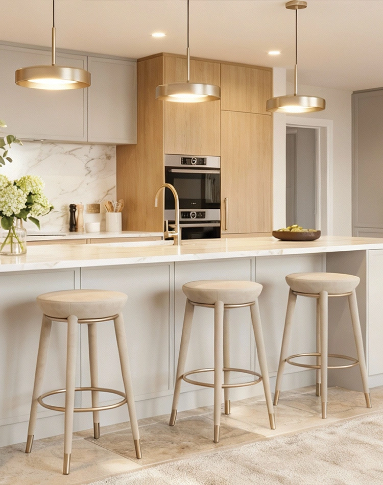 Rondi II bar chair by Nolita Harbour, bouclé upholstered walnut bar chair with brass footrest, sculptural seating at a contemporary kitchen island.