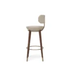Rondi bar stool by Nolita Harbour, velvet upholstered chair with curved walnut frame, metal footrest, and tailored comfort.