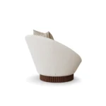 Anki luxury armchair by Nolita Harbour, curved velvet chair with ribbed walnut plinth and architectural silhouette.