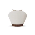 Anki walnut armchair by Nolita Harbour, velvet upholstered chair with sculptural curves and ribbed architectural base.