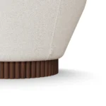 Anki designer armchair detail by Nolita Harbour, curved velvet armchair with continuous shell and elegant walnut plinth.