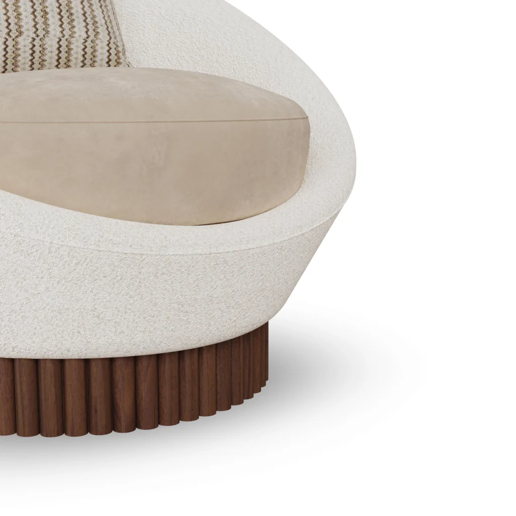 Anki velvet armchair detail by Nolita Harbour, luxury lounge chair with rounded shell and ribbed walnut plinth.