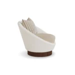 Anki armchair by Nolita Harbour, sculptural velvet chair with curved shell and refined walnut base.