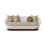 Anki upholstered sofa by Nolita Harbour in velvet, curved form with bouclé outer shell and solid walnut base, elegant design.