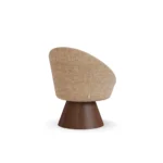 Basqui pedestal dining chair by Nolita Harbour, bouclé upholstered seat with sculptural walnut base and elegant wraparound design.