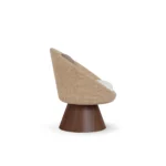 Basqui luxury dining chair by Nolita Harbour, bouclé chair with wraparound shell and conical walnut base, elegant silhouette.
