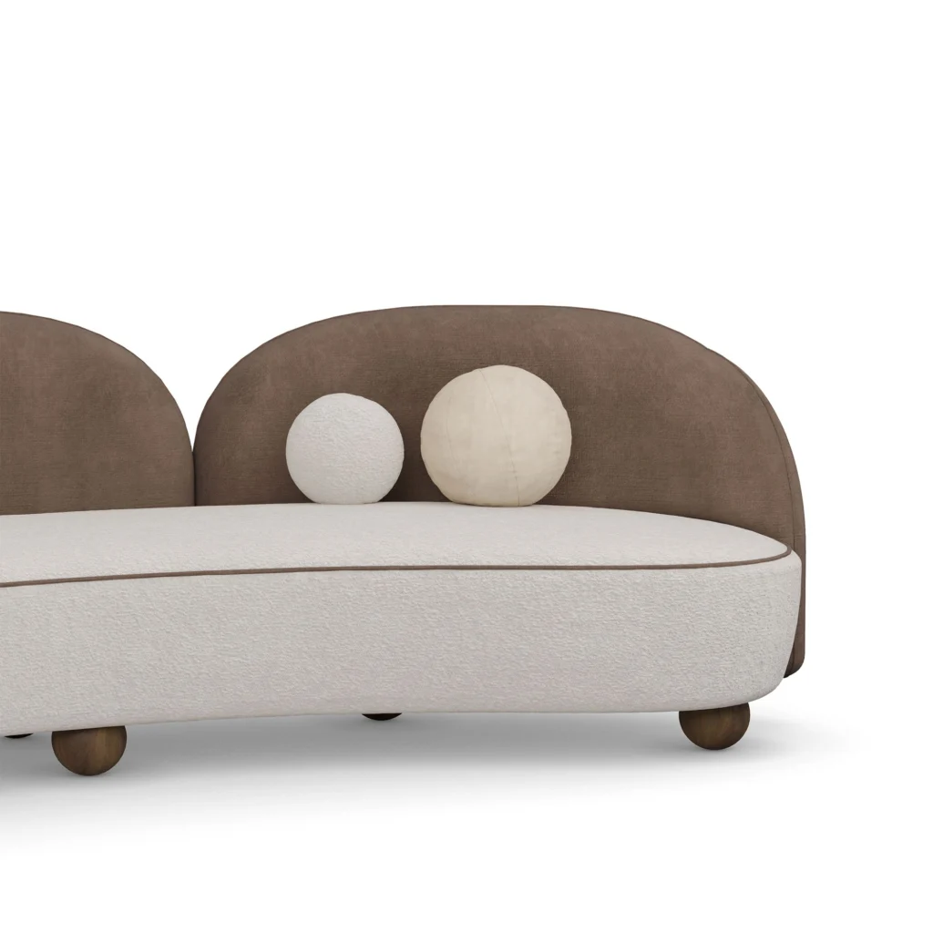 Ellora curved sofa detail by Nolita Harbour, velvet and bouclé upholstered sofa with sculptural form and organic flowing lines.