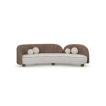 Ellora sofa by Nolita Harbour, sculptural curved sofa in velvet and bouclé with rounded wood feet and asymmetrical design.