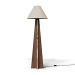 Bapt Floor Lamp, an elegant floor lamp by Nolita Harbour in wood and fabric with brass detail, featuring a geometric base.