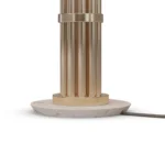 Detailed view of the Blaise Table Lamp, an elegant table lamp by Nolita Harbour combines marble base, gold detail, and fabric shade for soft light.