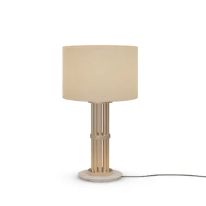 Blaise Table Lamp, a refined table lamp by Nolita Harbour in Estremoz marble, gold metal, and fabric shade, casting a warm glow.