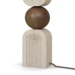 Christoph Table Lamp, a refined table lamp by Nolita Harbour combines travertine, walnut, and fabric shade for soft light.