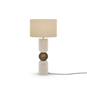 Christoph Table Lamp, a sculptural table lamp by Nolita Harbour in travertine, walnut, and fabric shade, casting a warm glow.