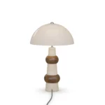 Claus Table Lamp, an elegant table lamp by Nolita Harbour in stone, wood, and dome shade, offering a calm ambient presence.