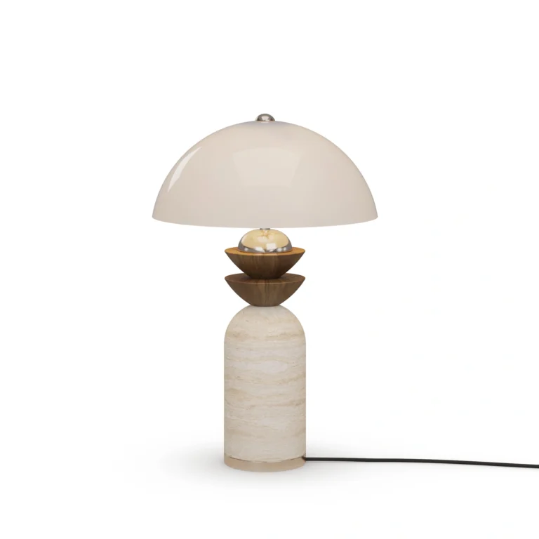 Gustav Table Lamp, a sculptural table lamp by Nolita Harbour in travertine, walnut, and a dome shade, casting a soft glow.
