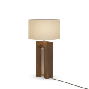 Louis Table Lamp, a sculptural table lamp by Nolita Harbour in walnut wood and fabric shade, casting a warm, even glow.