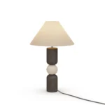 Luuk Table Lamp, a refined table lamp by Nolita Harbour that combines travertine, black wood, and fabric shade for soft light.