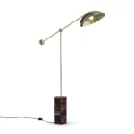 Marc Floor Lamp, a sculptural floor lamp by Nolita Harbour in Porto Rosso marble and polished metal, with adjustable dome shade.