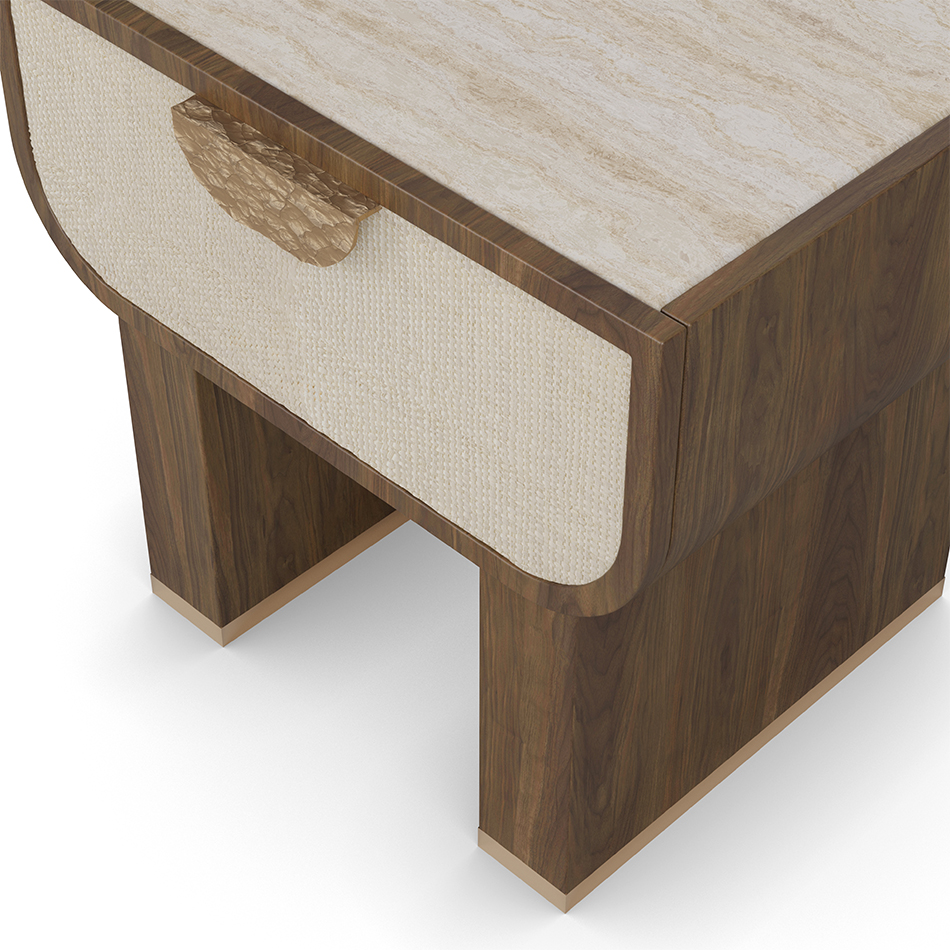 Rae nightstand with a thick drawer, travertine top, walnut frame, and hammered brass handle.