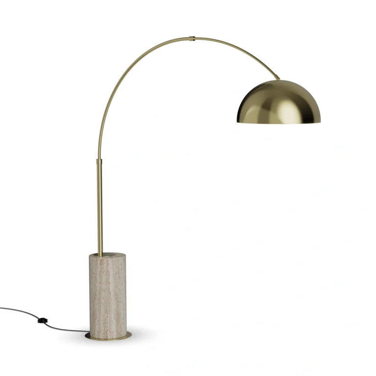 Nils Floor Lamp, a sculptural floor lamp by Nolita Harbour in travertine and brass, with arched frame and a dome shade.