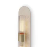 Taj Wall Lamp, a modern wall lamp by Nolita Harbour in travertine, brass, and glass, with a clean architectural form.