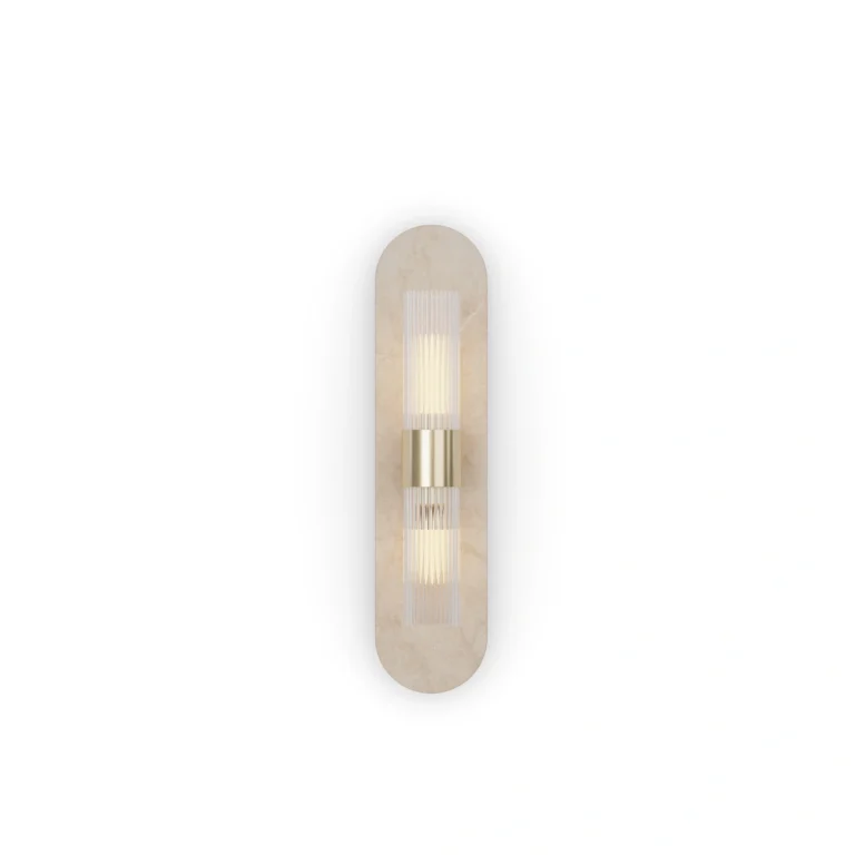 Taj Wall Lamp, an elegant wall lamp by Nolita Harbour in travertine, brass, and fluted glass, casting a soft ambient glow.
