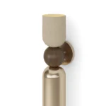 Tubi Wall Lamp, a sculptural wall lamp by Nolita Harbour in wood, brass and plaster, with a calm architectural line.