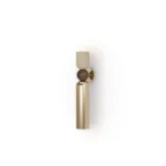 Tubi Wall Lamp, a refined wall lamp by Nolita Harbour in walnut, brass, and plaster shade, casting a warm ambient glow.