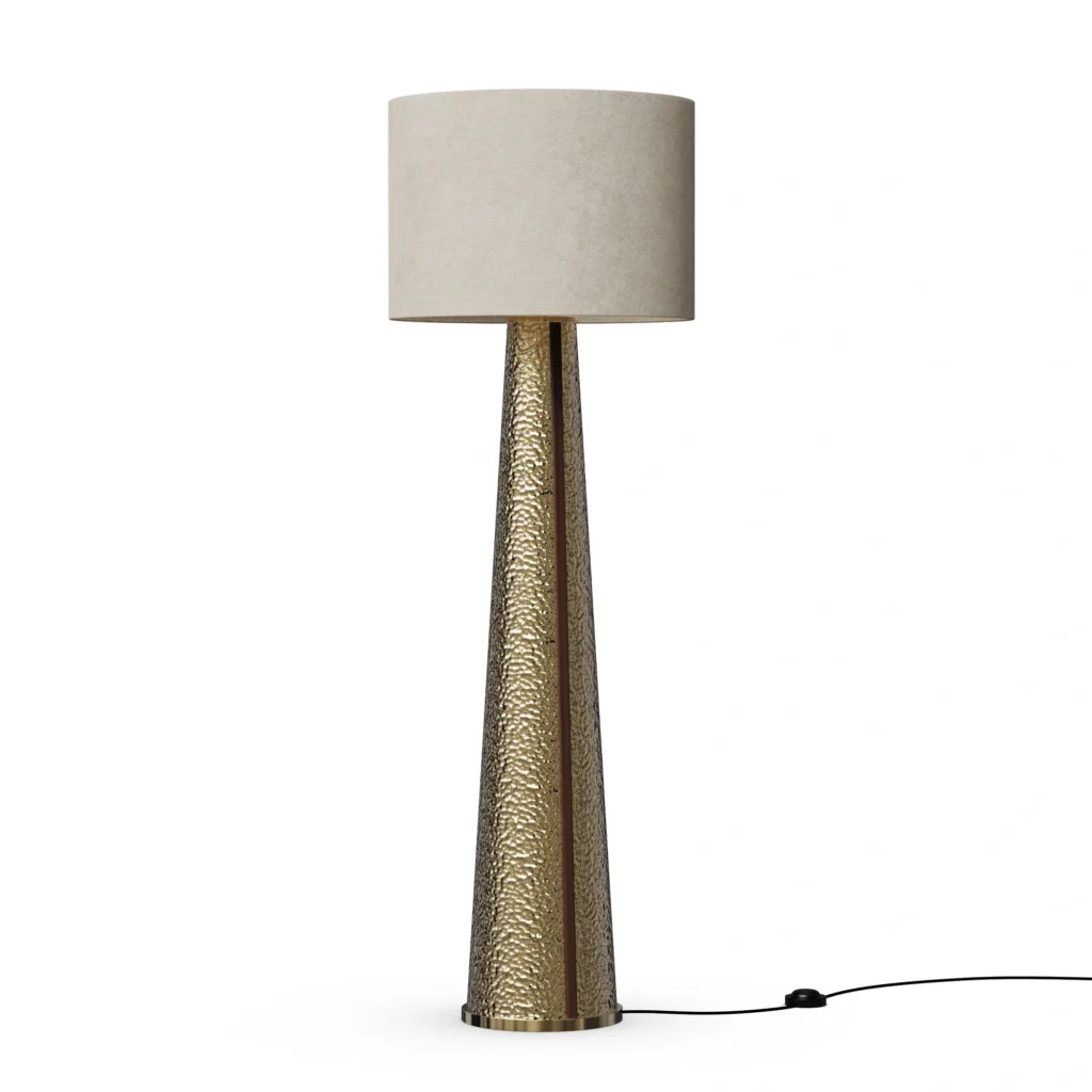 Yves Floor Lamp, a sculptural floor lamp by Nolita Harbour in hammered brass with fabric shade, casting a warm ambient glow.