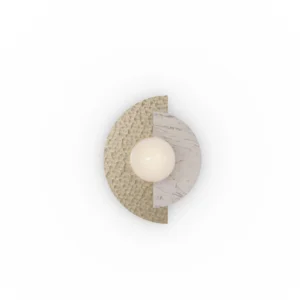 Noemi Wall Lamp wall light by Nolita Harbour in Estremoz marble, brushed metal, and opal glass globe, sculptural compact design casting soft ambient glow on textured stone surface.
