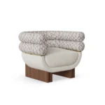 Amélie armchair by Nolita Harbour, bouclé upholstered armchair with walnut legs and brass detail, sculptural curved silhouette.