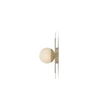 Side view of Noemi Wall Lamp wall fixture by Nolita Harbour featuring Estremoz marble backplate, slim brushed metal arm, and opal glass sphere, elegant architectural lighting for refined interiors.