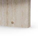 Oval travertine coffee table with two vertical slab legs and subtle brass accents, Landi by Nolita Harbour.